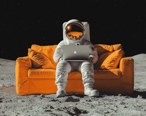 photo d'un astronaute avec un ordinateur portable, assis sur un canapé sur la lune